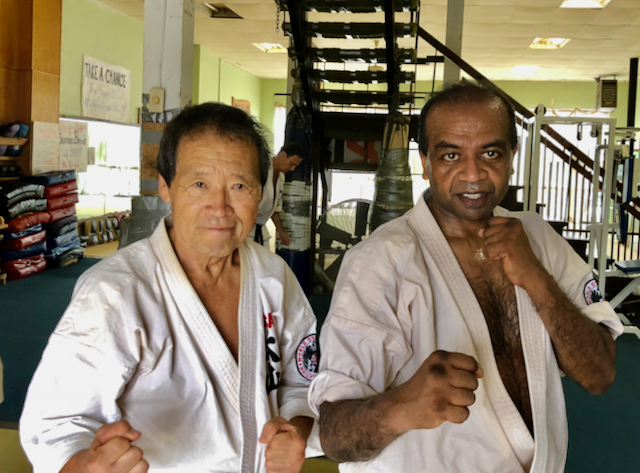 Dr. Bomi Joseph posing with Saiko Shihan Yasuhiko Oyama, the senior-most figure in Oyama Karate, after intense training at his dojo