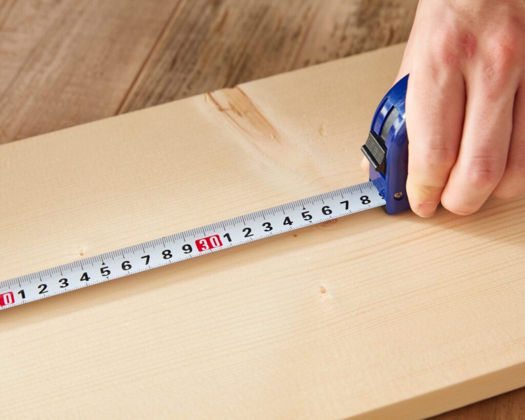 Tape measure stretched across wood representing the need to reassess nutritional measurements and standards