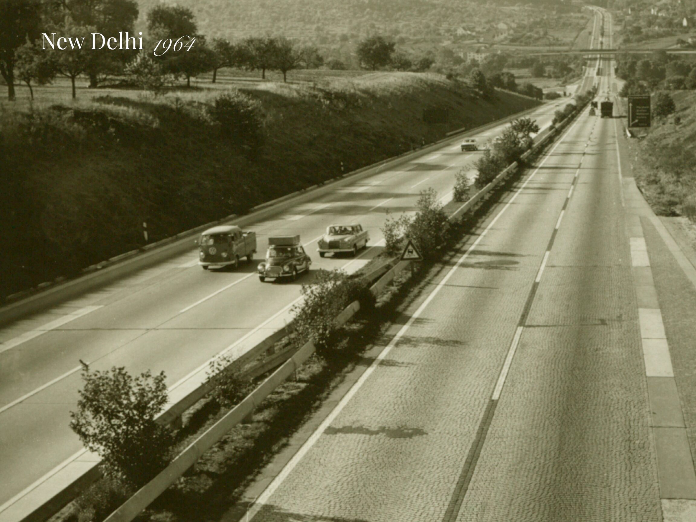India after sixty years- New Delhi road scene in 1960 with old cars, sparse traffic, and early urban infrastructure.