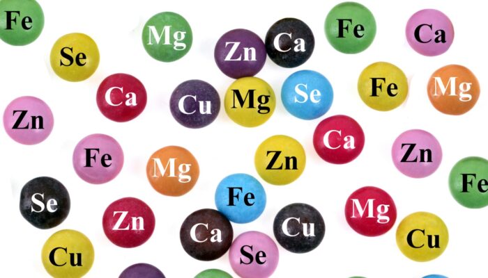 What Counts as Trace Elements Colorful spheres labeled with mineral symbols including iron, zinc, selenium, copper, magnesium, and calcium